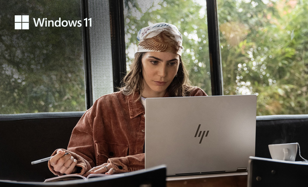 image of woman working with a trade in laptop