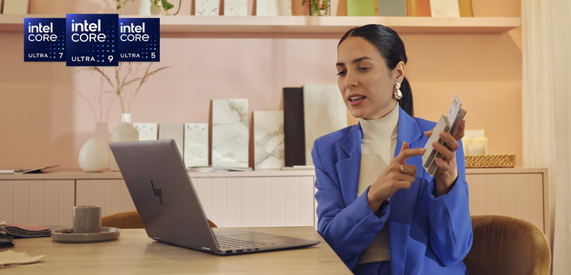 A woman working with a HP laptop equipped with an Intel® Core™ Ultra processor