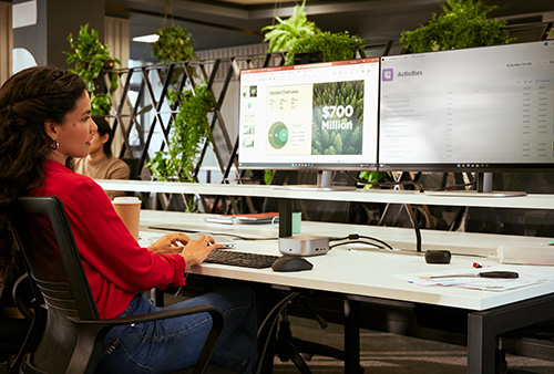 person working using hp dual monitors