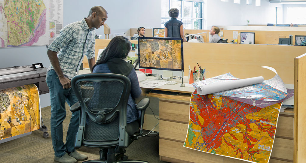 A man and women working on hp monitor